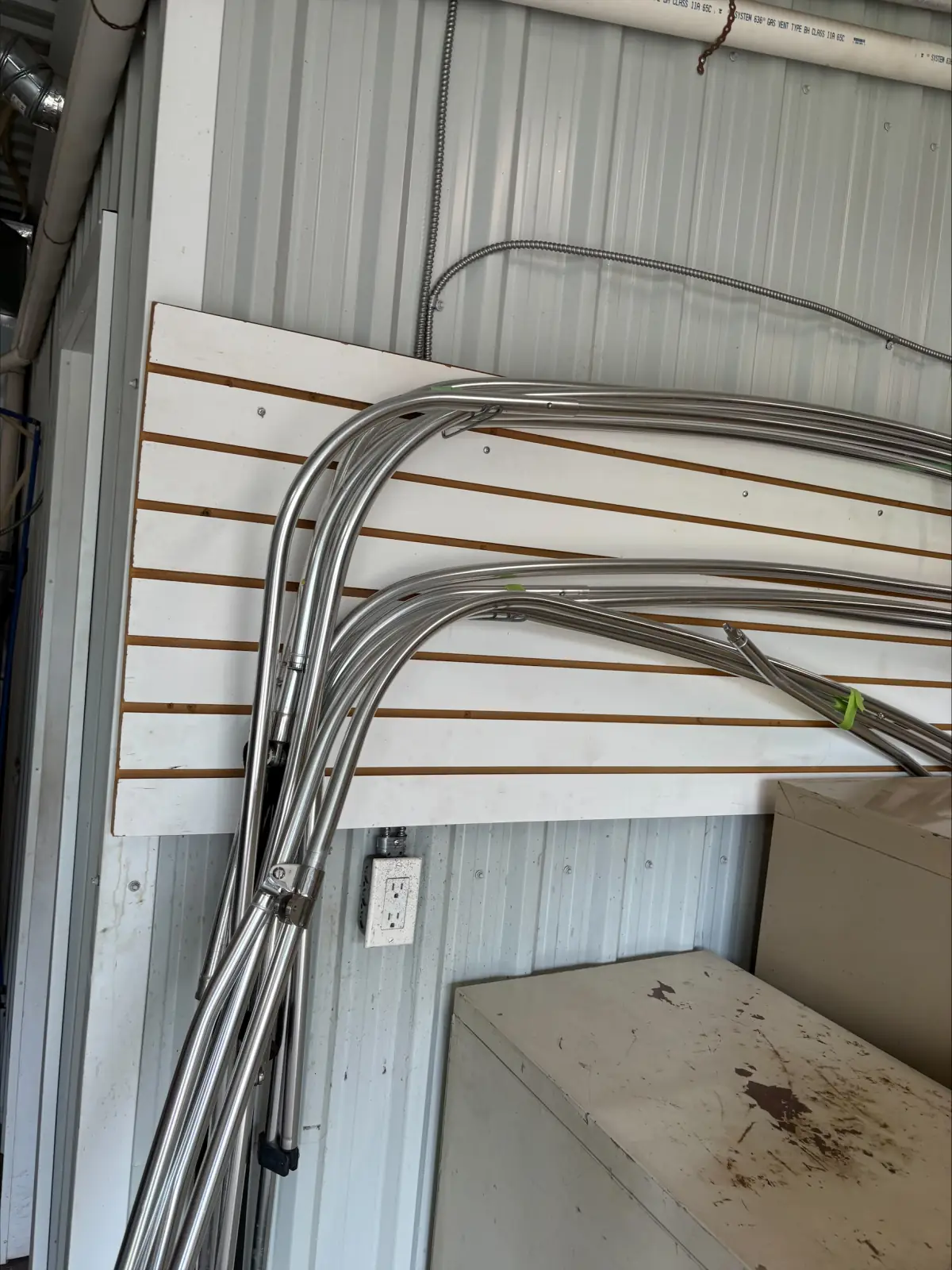Used bimini top frames stored on the wall at Hartzel Marine in Dunnville