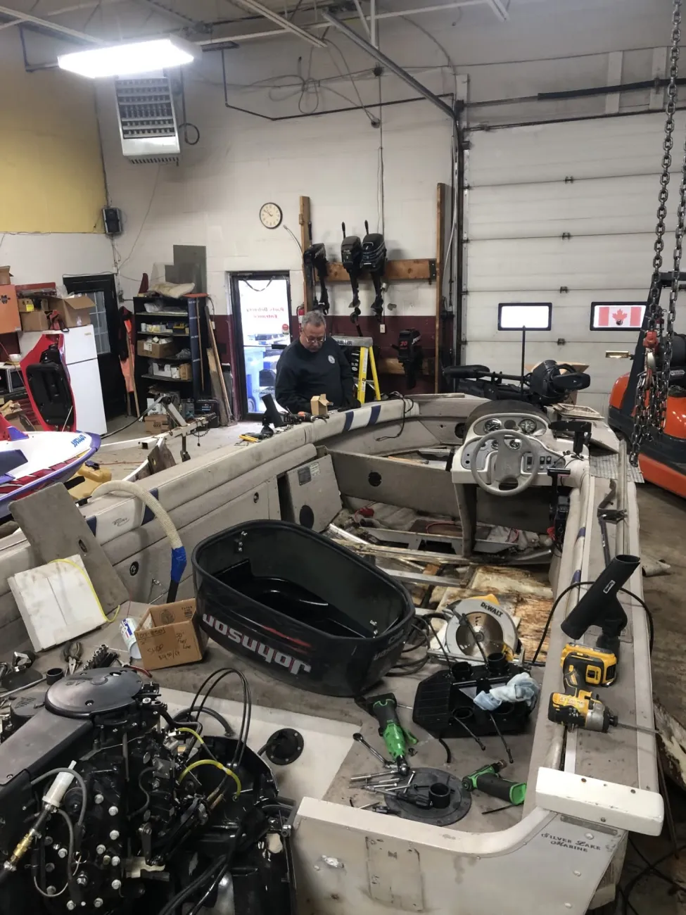 Fishing boat with its interior stripped out for a full floor and interior rebuild on the shop floor