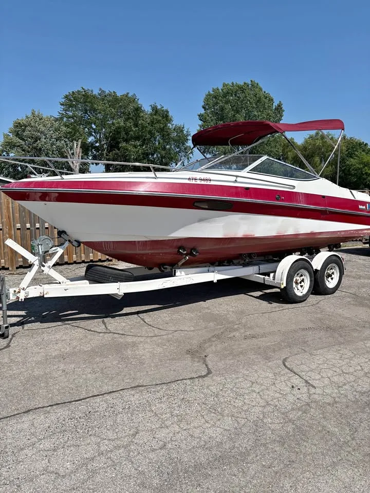 Bow quarter view of the 1991 Wellcraft 216 Eclipse on its trailer