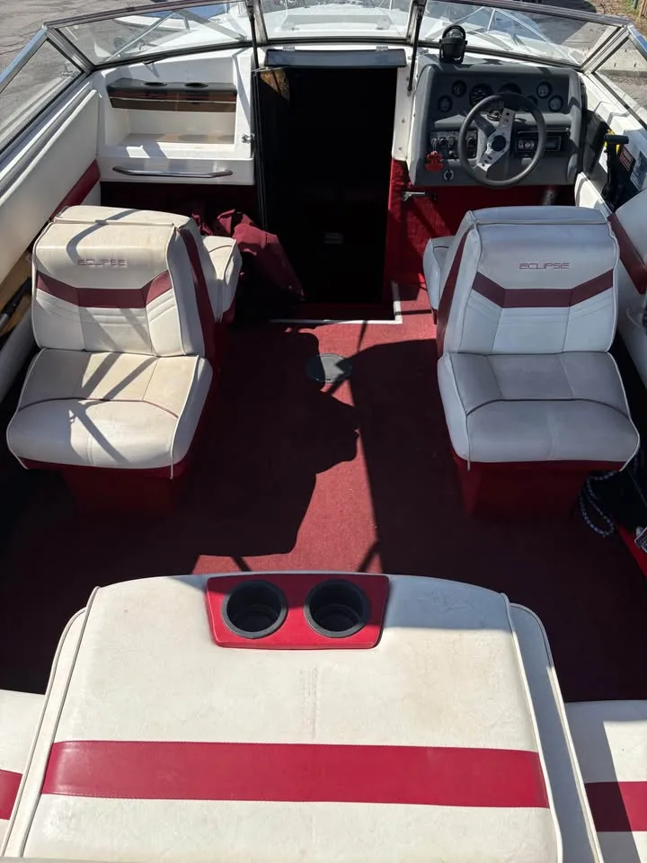 Cockpit and red interior of the 1991 Wellcraft 216 Eclipse