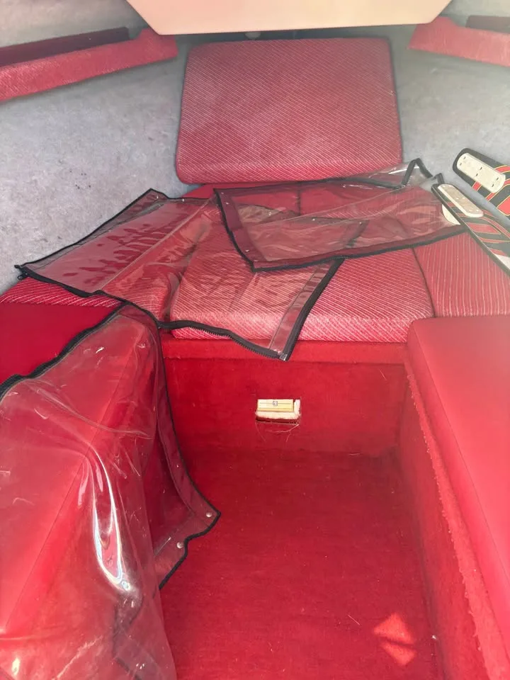 Red upholstery and cockpit cover aboard the Wellcraft 216 Eclipse