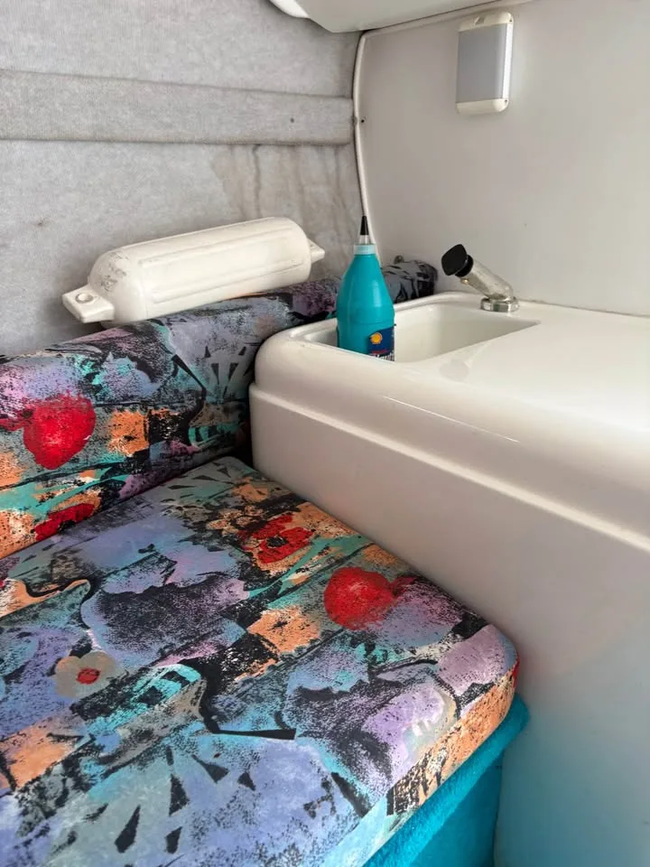 Cuddy cabin berth with sink and counter in the Wellcraft 236 Eclipse