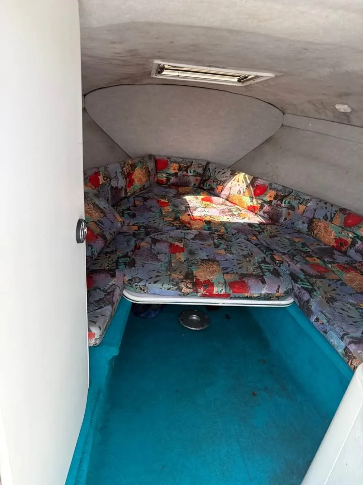 Forward cabin seating and table in the Wellcraft 236 Eclipse